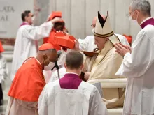 Cardinal Wilton Gregory receives the red hat from Pope Francis in St. Peter's Basilica on Nov. 28, 2020.